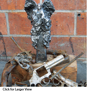 Angel sculpture with surrendered guns