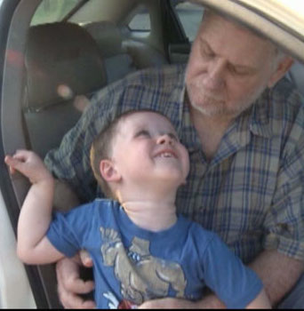 Three-year-old Keith Williams with the man he saved, 68-year-old Bob King.