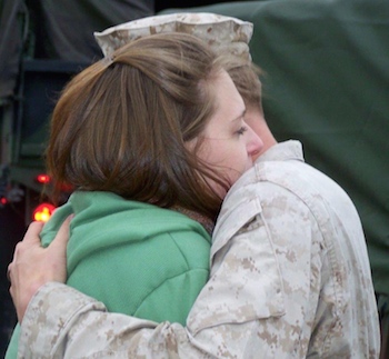 Edie's Marine Corps son hugs his wife before deployment