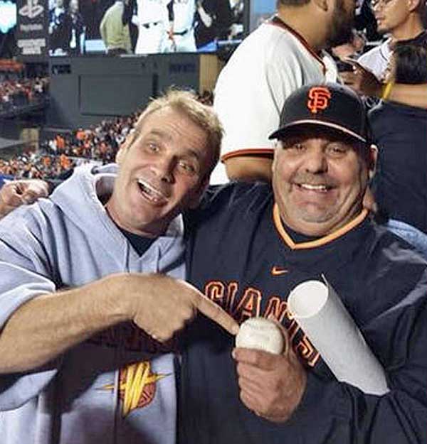 Frank Burke (in Giants cap) with friend Greg Leutza .
