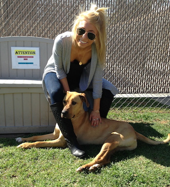 Michelle's daughter, Abby, visiting a dog shelter.