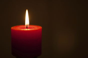 In Advent, a single candle lights the darkness. Photo Miriam2009, Thinkstock.