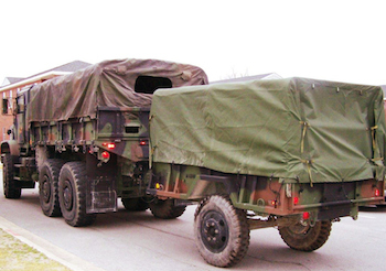 A military truck is prepared for deployment.