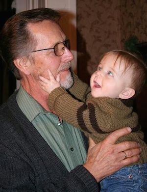 Shawnelle's dad lifting baby Isaiah several years ago.