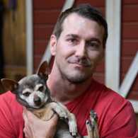 Lucky Dog host Brandon McMillan and a canine friend