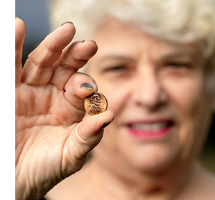 Linda displays the penny that calmed her