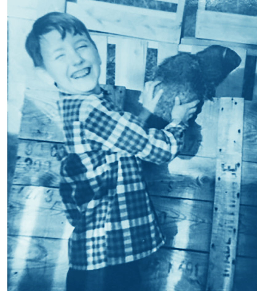 Young Robert Boggs holds Crisco the groundhog 